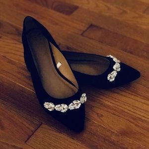 Black pointed toe flats with rhinestone detail!